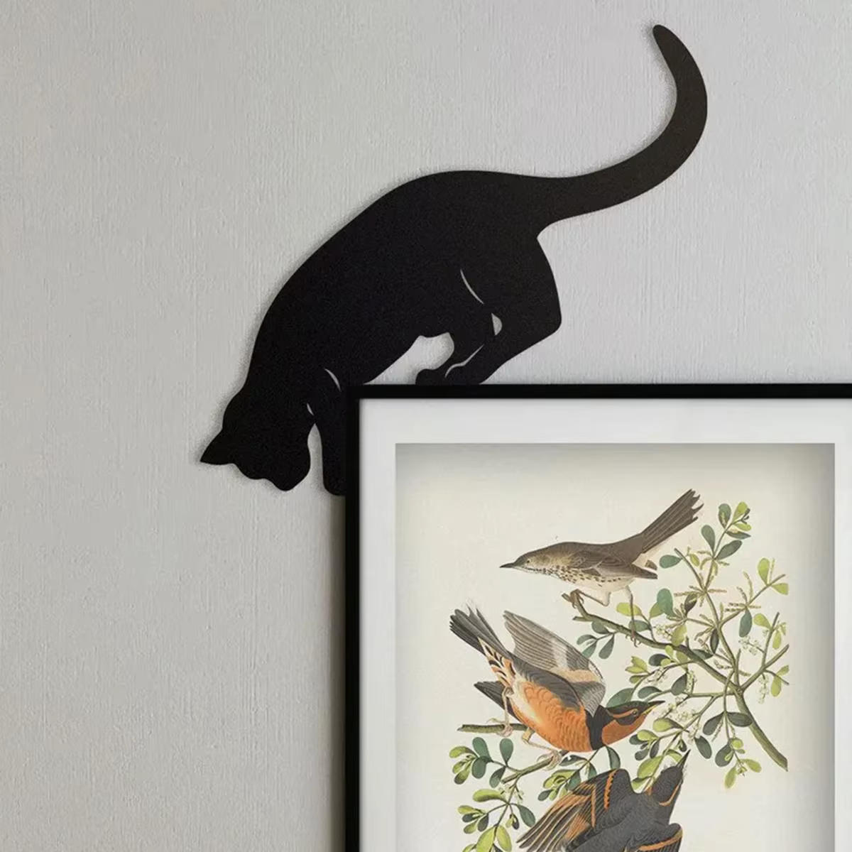 black cat silhouette pouncing on door frame minimalist decor