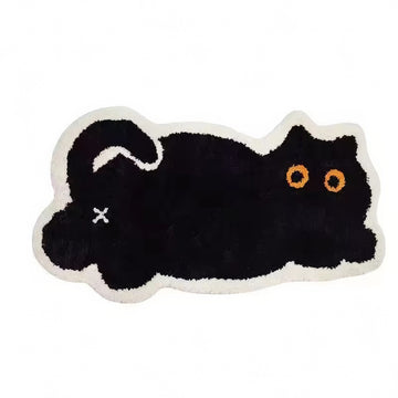 Black cat-shaped tufted rug with white border on a white background