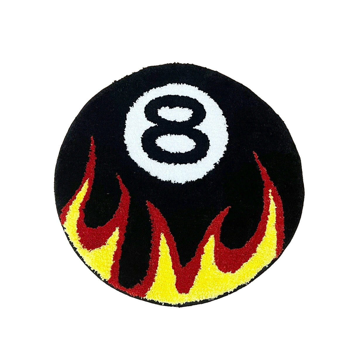 Round tufted rug with a black eight-ball design and red-yellow flame pattern.