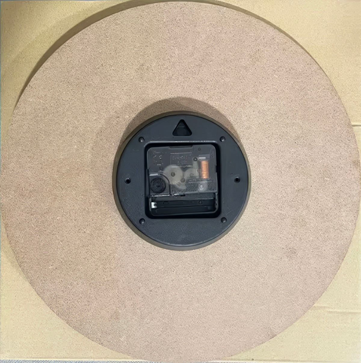 Round cartoon doodle wall clock with hand-drawn style numbers and sketch-like outline in black and white.