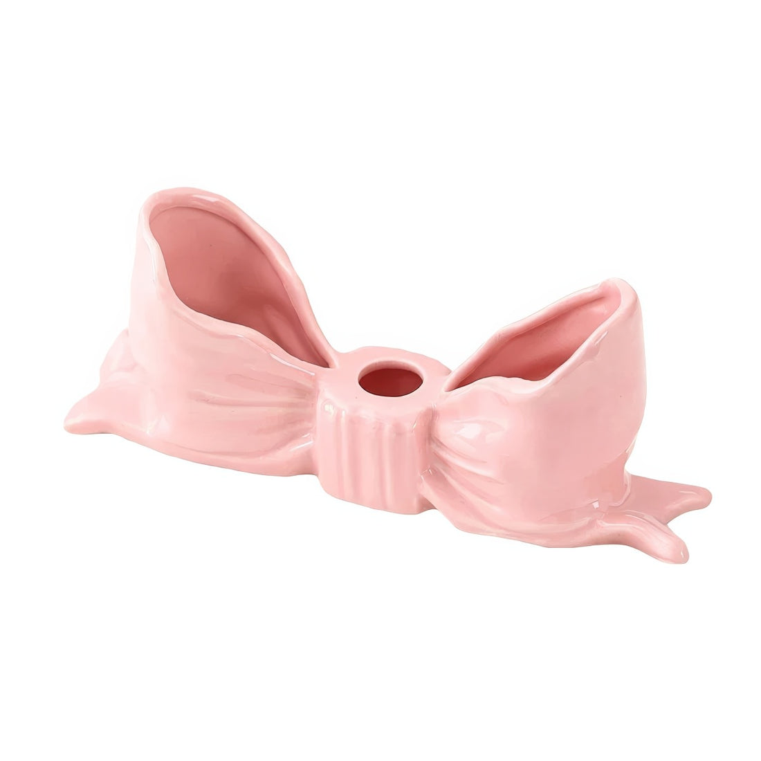 Ceramic bow-shaped candle holder in pink, red, and white with a glossy finish, designed to hold taper candles; decorative and elegant for home decor.