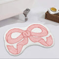 Pink bow-shaped bath mat coquette aesthetic accent rug