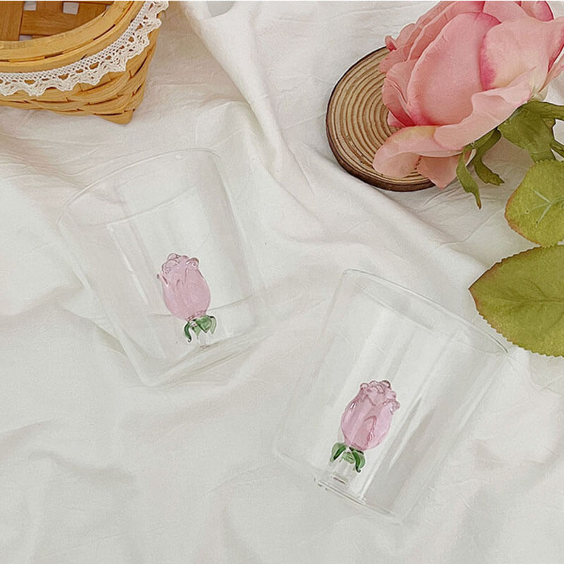 https://roomtery.com/cdn/shop/files/coquette-aesthetic-glass-cup-with-rosebud-figurine-roomtery2.jpg?v=1684867916&width=1946