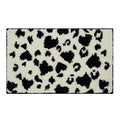 cow print black and white tufted rug