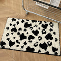 cow print black and white tufted rug