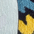 Black watch-shaped tufted rug with a retro 4:20 digital display, colorful lightning bolt graphics, and anti-slip backing
