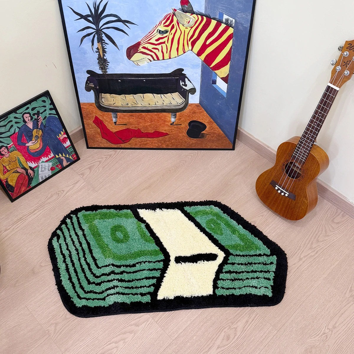 Tufted area rug designed as a stack of green dollar cash bills with a cream paper band