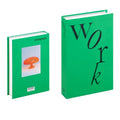 Decorative faux book storage box designed as a colorful hardcover book with a hidden storage compartment for organizing small household items while decorating shelves and tables