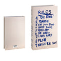 Decorative faux book storage box designed as a colorful hardcover book with a hidden storage compartment for organizing small household items while decorating shelves and tables