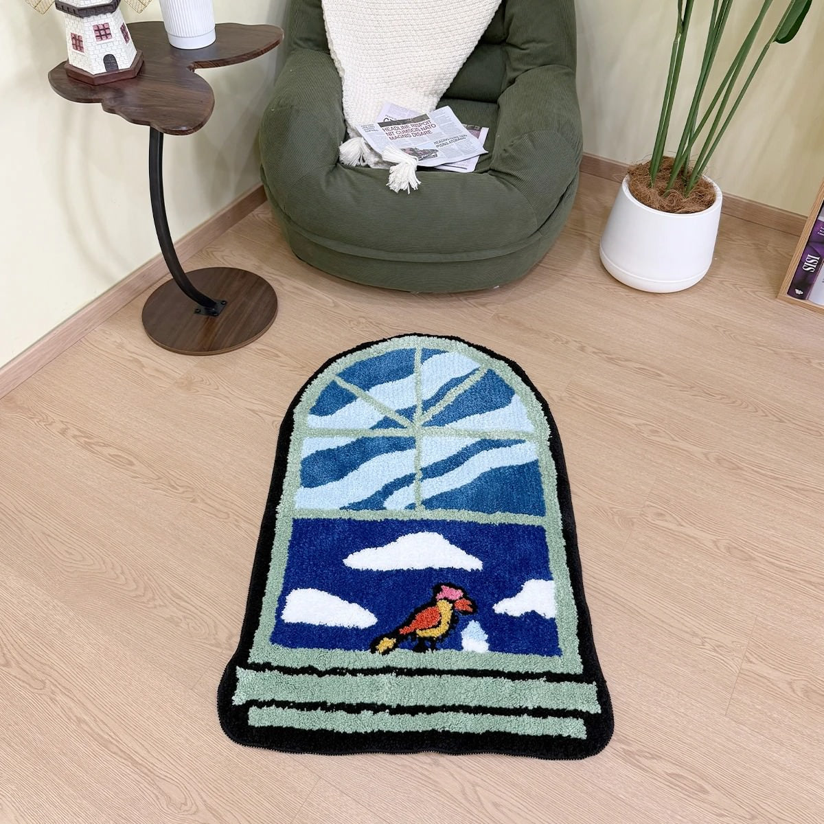 A tufted rug shaped like an arched window, displaying a blue sky with white clouds and a colorful bird on the sill