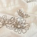light brown floral print on a creamy and brown textured duvet cover bedding set