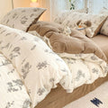 light brown floral print on a creamy and brown textured duvet cover bedding set