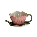 blooming pink flower shaped cup with green leaf shaped saucer
