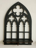 Three gothic-style black wooden wall display shelf candle holders