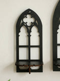 Three gothic-style black wooden wall display shelf candle holders