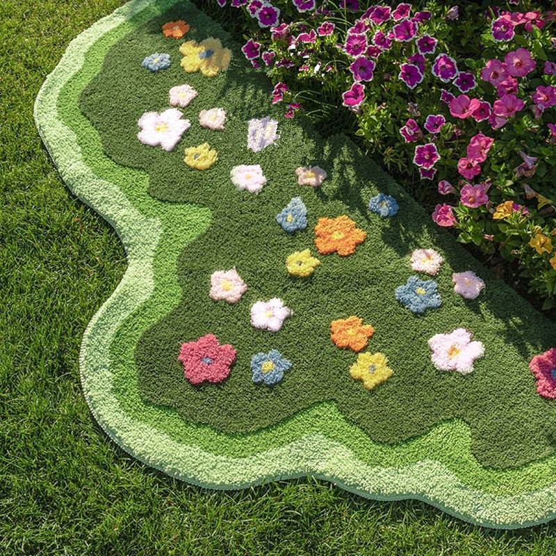 green lawn irregular shaped blooming colorful flowers tufted bedside accent rug