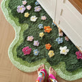 green lawn irregular shaped blooming colorful flowers tufted bedside accent rug