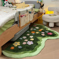 green lawn irregular shaped blooming colorful flowers tufted bedside accent rug