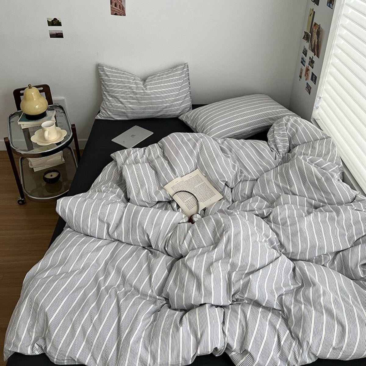 Minimalist grey and white striped duvet cover set with matching pillows and dark flat or fitted sheet set