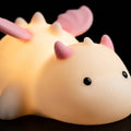 Cute white dragon silicone night light with pink or blue details and soft glowing body