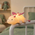 Cute white dragon silicone night light with pink or blue details and soft glowing body