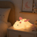 Cute white dragon silicone night light with pink or blue details and soft glowing body