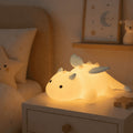 Cute white dragon silicone night light with pink or blue details and soft glowing body