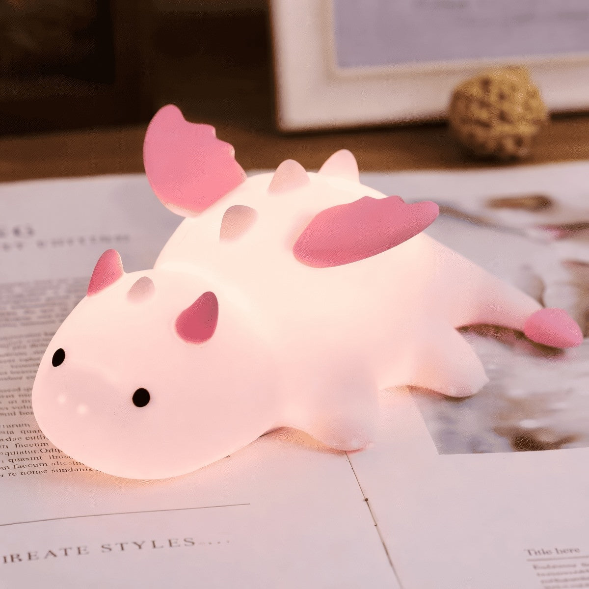 Cute white dragon silicone night light with pink or blue details and soft glowing body
