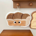 Plush kawaii hanging hand towel shaped like bread, croissant, toast, egg toast, and garlic with embroidered faces and hanging loops.
