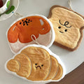 Plush kawaii hanging hand towel shaped like bread, croissant, toast, egg toast, and garlic with embroidered faces and hanging loops.