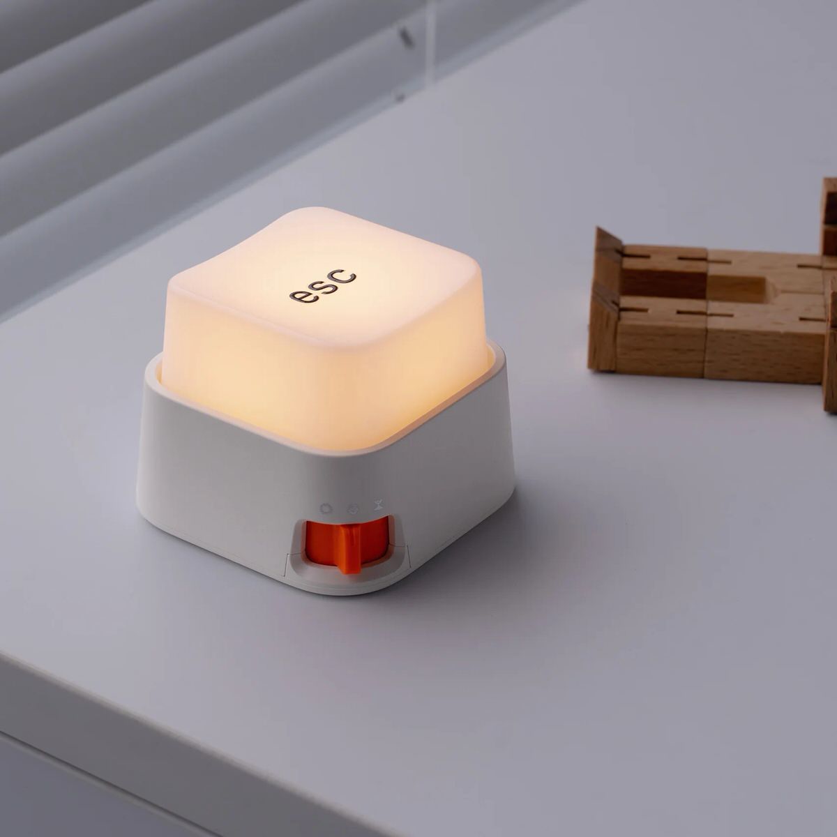 Rechargeable keyboard key-shaped LED night light with a soft warm glow, oversized mechanical keycap design, and tactile press switch for desks and bedside tables.