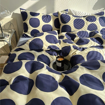 aesthetic bedding duvet cover set with large blue polka dot pattern print on beige/white background