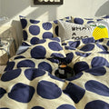 aesthetic bedding duvet cover set with large blue polka dot pattern print on beige/white background