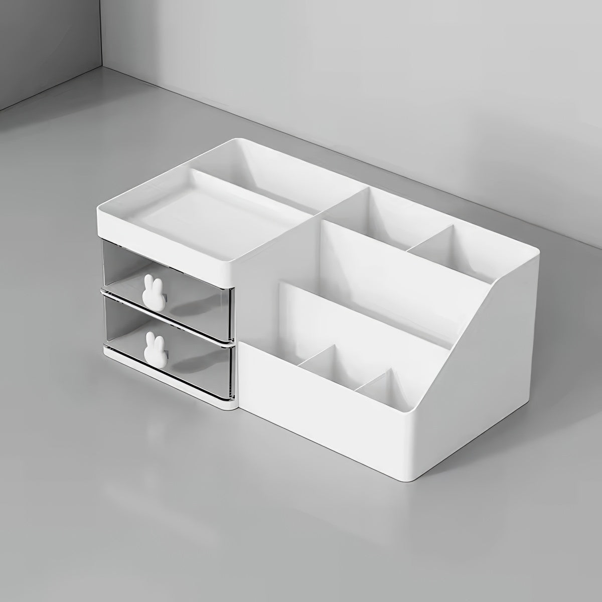 White plastic desk organizer with bunny drawer handles, two drawers, and six open compartments, sized 28.5cm x 17cm x 12cm.