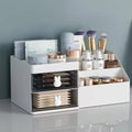 White plastic desk organizer with bunny drawer handles, two drawers, and six open compartments, sized 28.5cm x 17cm x 12cm.