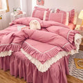 Pink ruffled bedding set with white frill trim, including a duvet cover, pillowcases, and bed skirt, in a soft and feminine coquette aesthetic