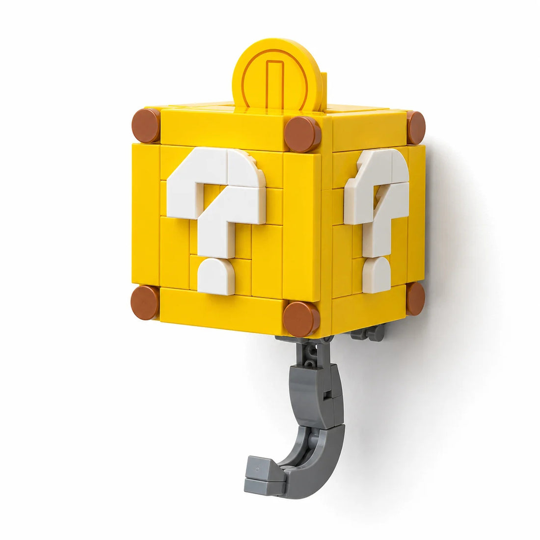 Two yellow block-style key hooks designed like Super Mario question blocks. Yellow Mystery Box hidden hook key holder with white question mark design
