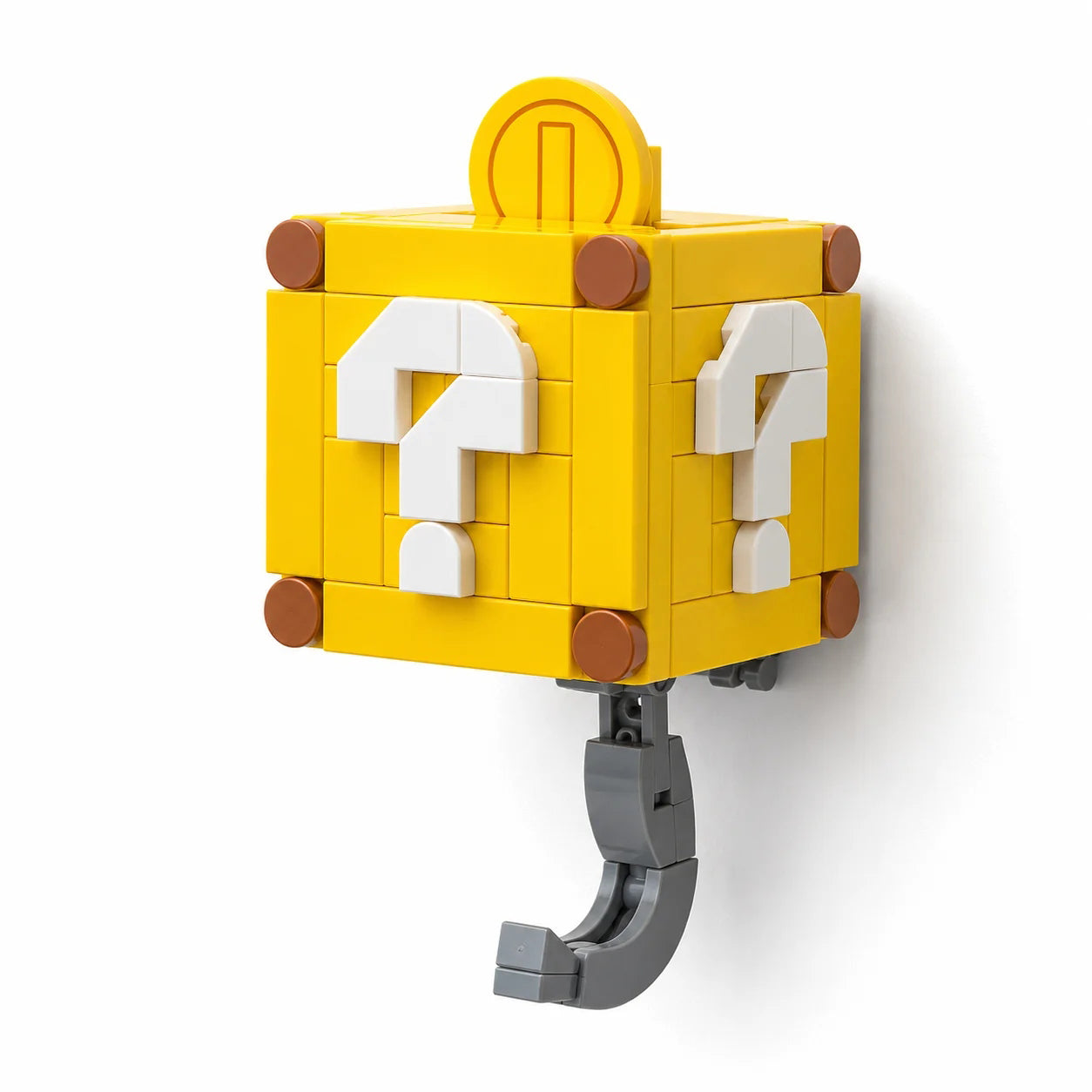 Two yellow block-style key hooks designed like Super Mario question blocks. Yellow Mystery Box hidden hook key holder with white question mark design