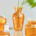 glossy orange color with ribbed texture vintage aesthetic glass vase