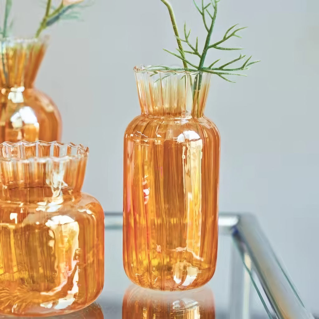 glossy orange color with ribbed texture vintage aesthetic glass vase
