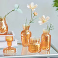 glossy orange color with ribbed texture vintage aesthetic glass vase