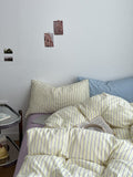 pale pastel aesthetic striped yellow, lilac, and light blue bedding duvet cover set 