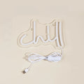 Pink Chill LED neon wall sign in cursive lettering mounted on clear acrylic backing with USB cable.