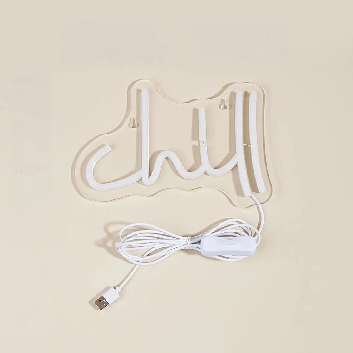 Pink Chill LED neon wall sign in cursive lettering mounted on clear acrylic backing with USB cable.