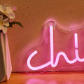 Pink Chill LED neon wall sign in cursive lettering mounted on clear acrylic backing with USB cable.