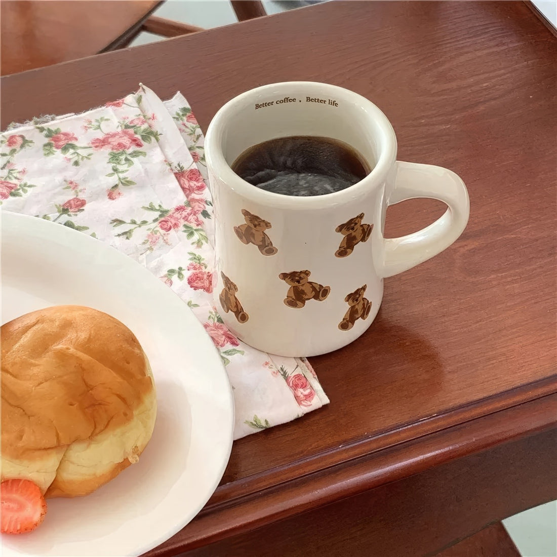 beige mug with teddy bear pattern on a white background