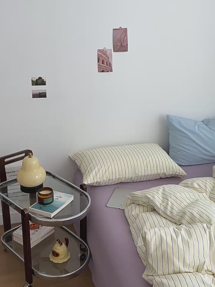 pale pastel aesthetic striped yellow, lilac, and light blue bedding duvet cover set 