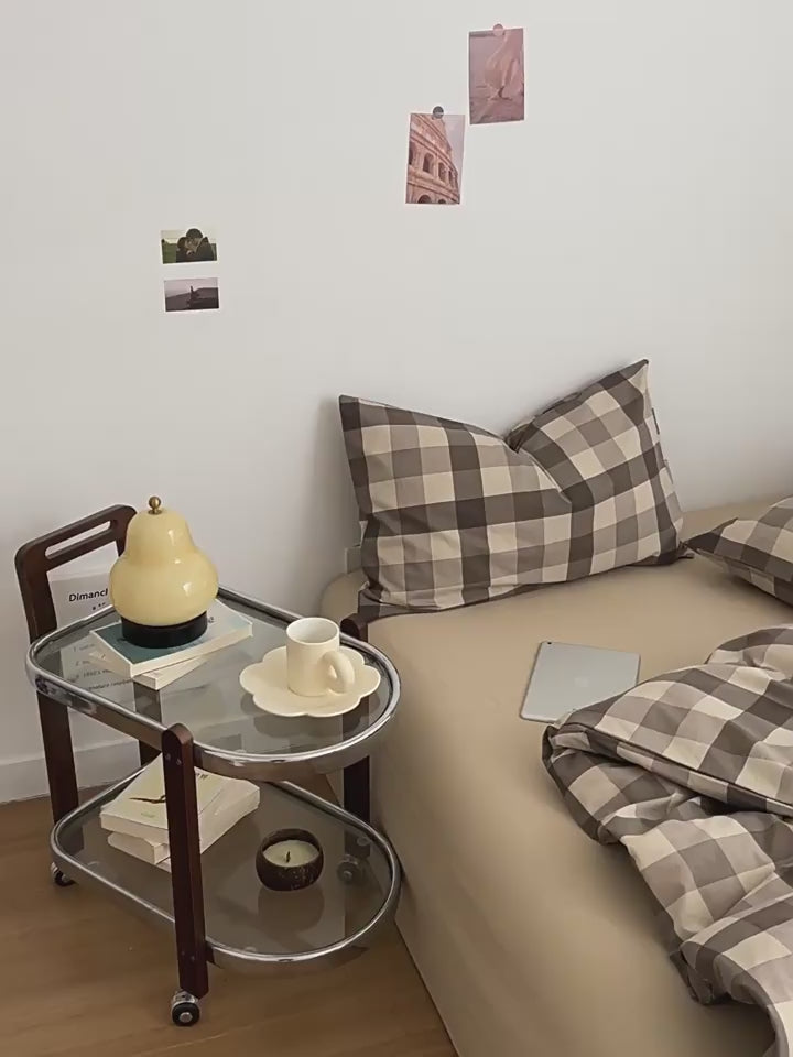 Neutral-toned gingham check bedding set in brown and beige with pillows and cozy duvet cover 