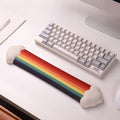 A rainbow-themed ergonomic wrist rest set, including a cloud-cushioned mouse pad and a matching keyboard wrist support, designed with a gradient rainbow pattern and soft white cloud accents