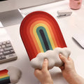 A rainbow-themed ergonomic wrist rest set, including a cloud-cushioned mouse pad and a matching keyboard wrist support, designed with a gradient rainbow pattern and soft white cloud accents